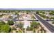 A high-angle aerial view of a suburban neighborhood with houses, trees, and roadways on a sunny day at 804 N 46Th St, Mesa, AZ 85205