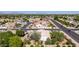 Aerial view of neighborhood with well maintained landscaping, tile roofs, and a nearby highway at 804 N 46Th St, Mesa, AZ 85205