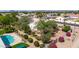 Aerial view of backyard featuring pool, mature trees, and vibrant landscaping at 804 N 46Th St, Mesa, AZ 85205