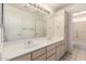 Well-lit bathroom with double sinks, large mirror, and plenty of storage space at 804 N 46Th St, Mesa, AZ 85205