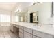 Bathroom with double sink vanity, large mirror, and separate shower and tub at 804 N 46Th St, Mesa, AZ 85205