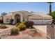 Charming single-story home with arched entry, desert landscaping, and three-car garage at 804 N 46Th St, Mesa, AZ 85205