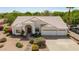 Charming home featuring desert landscaping, a driveway, an arched entryway, and a two-car garage at 804 N 46Th St, Mesa, AZ 85205