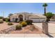 Inviting single-story home featuring lush desert landscaping, a driveway, and a two-car garage at 804 N 46Th St, Mesa, AZ 85205