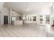Open concept kitchen featuring tile floors, natural light, and white cabinetry at 804 N 46Th St, Mesa, AZ 85205