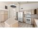 Kitchen with white appliances, tile floors, and plenty of cabinet space at 804 N 46Th St, Mesa, AZ 85205