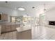 Bright kitchen with white appliances, tile flooring, and a breakfast bar area at 804 N 46Th St, Mesa, AZ 85205