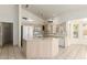 Kitchen with white appliances, center island, and tile flooring at 804 N 46Th St, Mesa, AZ 85205
