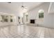 Spacious living room with fireplace, tile flooring, and ample natural light from large windows at 804 N 46Th St, Mesa, AZ 85205