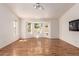 Living room with wood floors and windows overlooking backyard at 804 N 46Th St, Mesa, AZ 85205