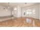 Spacious living room with hardwood floors, arched windows, and a view of the front yard at 804 N 46Th St, Mesa, AZ 85205