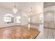 Bright, open living room with hardwood floors, large windows, and elegant light fixtures at 804 N 46Th St, Mesa, AZ 85205