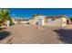 Gravel backyard is landscaped with trees, shrubs, and has a storage shed at 8103 E Southern Ave # 69, Mesa, AZ 85209