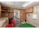 This basement features wood paneling, storage, desk space, and ample room at 8103 E Southern Ave # 69, Mesa, AZ 85209