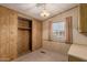 Bedroom showing a closet, window and wood paneling at 8103 E Southern Ave # 69, Mesa, AZ 85209