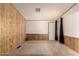 Bedroom featuring carpet, mixed wood paneling and an open entry at 8103 E Southern Ave # 69, Mesa, AZ 85209