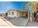 Front exterior view of single story home with a covered carport and low maintenance desert landscaping at 8103 E Southern Ave # 69, Mesa, AZ 85209