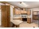 Functional kitchen with classic appliances, laminate countertops and an adjacent dining space at 8103 E Southern Ave # 69, Mesa, AZ 85209