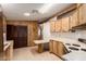 Efficient kitchen featuring laminate countertops, wood cabinets and classic white appliances at 8103 E Southern Ave # 69, Mesa, AZ 85209