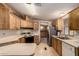 Well-maintained kitchen with laminate countertops, and view into the adjacent dining room at 8103 E Southern Ave # 69, Mesa, AZ 85209