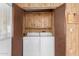 This laundry room features wood paneling, a washer and dryer, and ample storage at 8103 E Southern Ave # 69, Mesa, AZ 85209