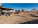 Large backyard featuring gravel, patio area, grill, trampoline, and RV parking at 8415 W Coolidge St, Phoenix, AZ 85037
