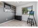 This bedroom includes a gray accent wall, wood shelves, and a window for natural light at 8415 W Coolidge St, Phoenix, AZ 85037