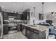 Modern kitchen featuring granite countertops, stainless steel appliances, and stylish dark wood cabinets at 8415 W Coolidge St, Phoenix, AZ 85037
