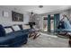 Spacious living room featuring modern decor, tile floors, comfortable seating, and ample natural light at 8415 W Coolidge St, Phoenix, AZ 85037