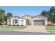 A charming single-Gathering home with a well-manicured lawn and a neutral-colored facade at 9621 W Monterey Way, Phoenix, AZ 85037
