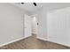 Neutral bedroom with wood-look tile floor and closet at 1051 S Dobson Rd # 67, Mesa, AZ 85202
