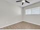 Bright bedroom features neutral walls, modern ceiling fan, and wood-look floors at 1051 S Dobson Rd # 67, Mesa, AZ 85202