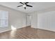 Inviting bedroom with ample storage, a modern ceiling fan, and natural light at 1051 S Dobson Rd # 67, Mesa, AZ 85202