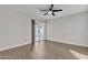 Bedroom showcasing wood-look floors and a sliding glass door to the back patio at 1051 S Dobson Rd # 67, Mesa, AZ 85202