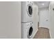 Convenient laundry area with stacked washer and dryer, optimizing space at 1051 S Dobson Rd # 67, Mesa, AZ 85202