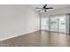 Open living room featuring vaulted ceilings, a sliding glass door to the patio, and neutral paint at 1051 S Dobson Rd # 67, Mesa, AZ 85202