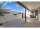 Back patio enclosed by a privacy wall with an access gate; great for outdoor living at 1051 S Dobson Rd # 67, Mesa, AZ 85202
