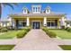 Beautiful community clubhouse with yellow exterior and manicured lawn at 10538 E Naranja Ave, Mesa, AZ 85209
