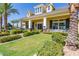 Community clubhouse with covered porch, nice landscaping, and green grass at 10538 E Naranja Ave, Mesa, AZ 85209