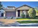 Charming single-story home featuring a stone-accented entrance, low-maintenance landscaping, and a two-car garage at 10538 E Naranja Ave, Mesa, AZ 85209