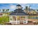 Community gazebo offering shaded relaxation near the tennis court and verdant landscaping at 10538 E Naranja Ave, Mesa, AZ 85209