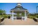 Community gazebo with a clock tower, offering a shaded area for relaxation and gatherings at 10538 E Naranja Ave, Mesa, AZ 85209