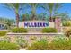 Mulberry community entrance sign with lush landscaping and decorative stone accents at 10538 E Naranja Ave, Mesa, AZ 85209