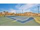 Tennis court within a community, palm trees in the background at 10538 E Naranja Ave, Mesa, AZ 85209