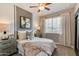 Inviting bedroom with a comfortable bed, soft lighting, and stylish decor, offering a relaxing retreat at 10556 W Bloch Rd, Tolleson, AZ 85353