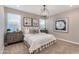 Serene bedroom with neutral tones, stylish furnishings, and ample natural light, creating a relaxing retreat at 10556 W Bloch Rd, Tolleson, AZ 85353