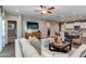 Bright and airy living area with comfortable seating, a dining table, and modern kitchen for seamless entertaining at 10556 W Bloch Rd, Tolleson, AZ 85353