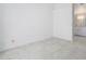 Bright bedroom features modern tile flooring and ensuite bathroom with marble vanity at 10613 S 41St Pl, Phoenix, AZ 85044