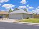 Single-Gathering home boasts a two-car garage, well-manicured lawn, and desert landscaping at 10613 S 41St Pl, Phoenix, AZ 85044