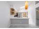 Well-lit kitchen featuring modern appliances, ample counter space, and sleek light wood cabinetry at 10613 S 41St Pl, Phoenix, AZ 85044